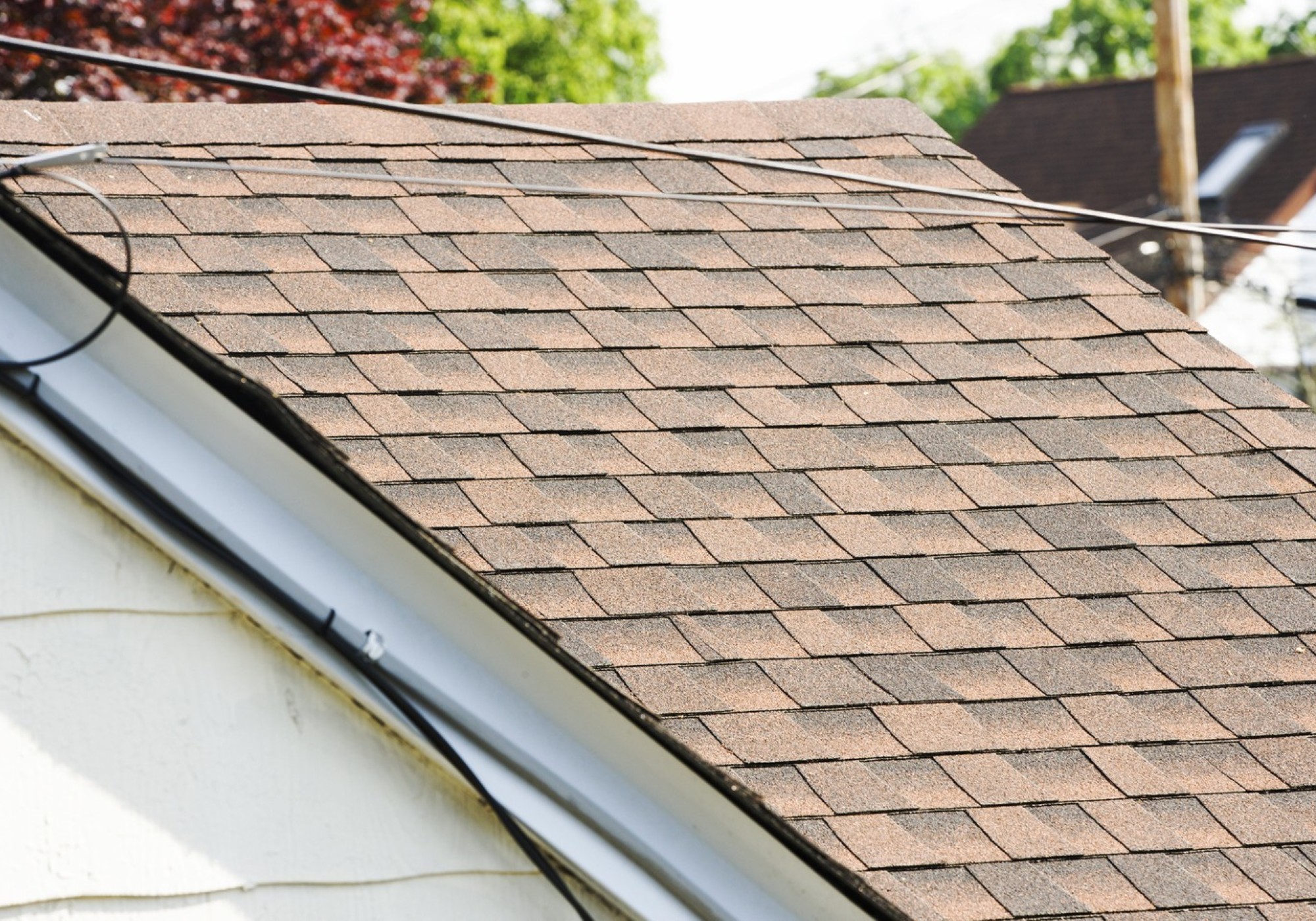 Brown shingle roof with gutter system