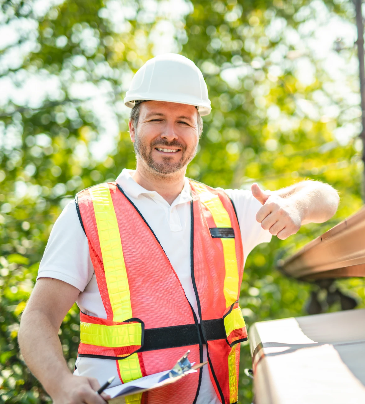 Construction worker giving thumbs up outdoors